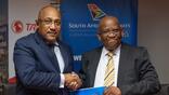 Nelson Rodrigues de Oliveira, CEO of TAAG (left) and Tebogo Tsimane, SAA’s Chief Commercial Officer, sign a codeshare at the AFRAA annual meeting