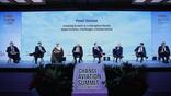 Simon Hocquard (first from right) sits on stage at the Changi Aviation Summit.