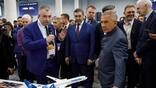 Tupolev Deputy Chief Designer Kirill Aseev (left) shows the Tu-454 model to the head of Russia’s Tatarstan region.
