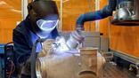 Liebherr-Aerospace employee with heat transfer equipment