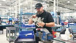 AJW Technique staff member conducting repair on part