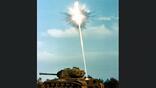 Extended-Range Anti-armor Munition (ERAM) warhead fires self-forging fragment into an M-48 full-tracked combat tank target during a validation demonstration test. Base: Otis Air National Guard Base State: Massachusetts (MA) Country: United States Of America (USA) Contributor: NB/ROD