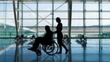 Man in a wheelchair at the airport