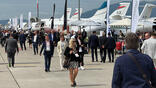 People walking past static aircraft display