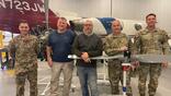 Jesse Hauch (pictured center) is an aviation maintenance instructor at Delaware Technical Community College and a designated mechanic examiner.