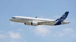 An A220 in Airbus livery flying