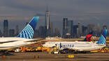 United Airlines and Delta Air Lines aircraft on runway at Newark International Airport