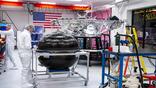 Astrobotic staff examine a propulsion tank sitting in front of Griffin-1’s structure.