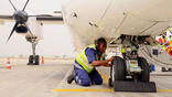 TAAG Angola technician working on aircraft