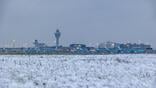 Amsterdam Schiphol Airport in the winter of 2025 with snow on the ground