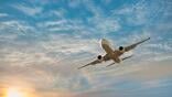 generic aircraft inflight with sunset