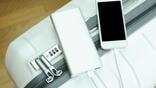 power bank and cellphone on top of luggage