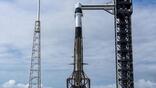 A SpaceX Falcon 9 rocket, with the company’s Dragon spacecraft atop, stands at Space Launch Complex 40 at Cape Canaveral Space Force Station in Florida on Wednesday, May 13, 2026, i