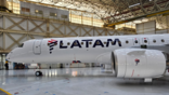 A LATAM aircraft in a hangar